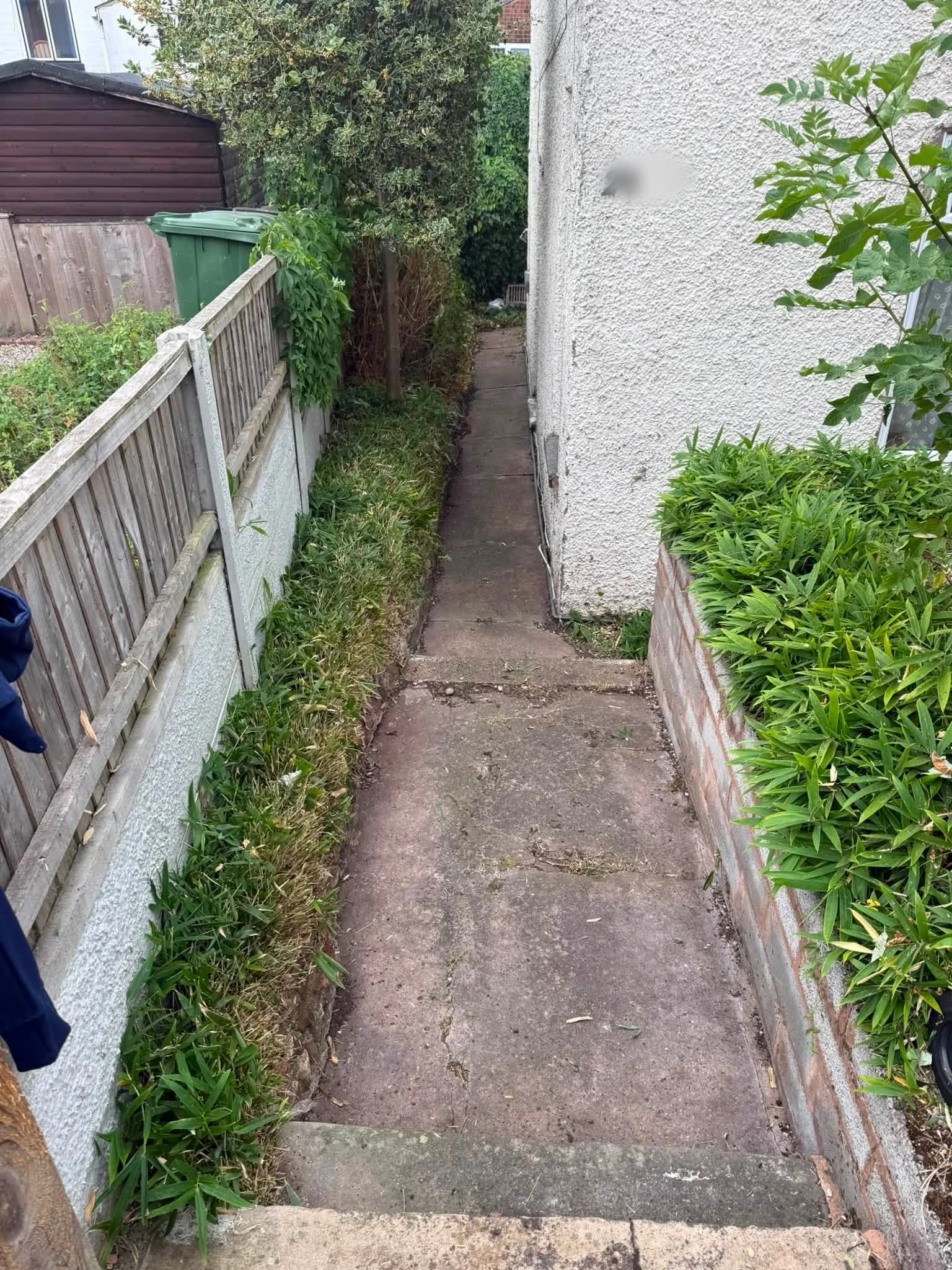Evesham side passage after garden clearance, with paving visible